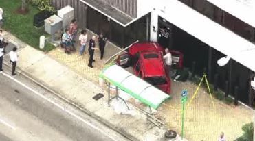 Car crashes into building, 65-year-old woman in Miami