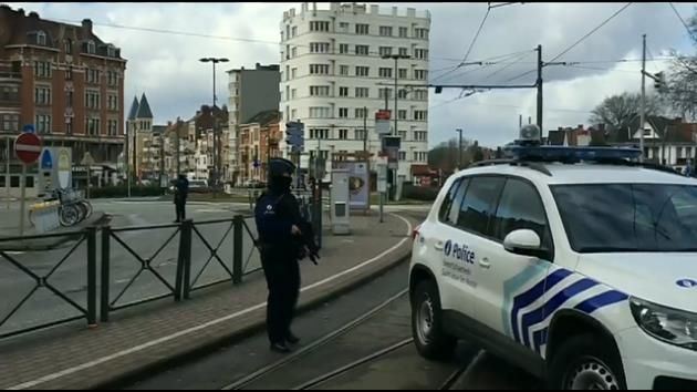 Brussels police conduct more raids linked to deadly bombings