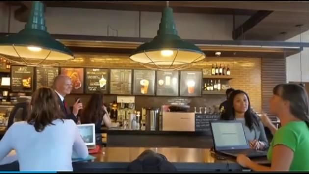 South Florida activist yells at Gov. Scott at Gainesville Starbucks