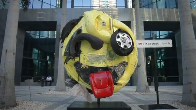 Eye-popping emoji sculpture aims at preventing drivers from texting in Miami