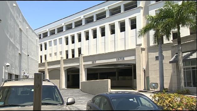 Elderly woman held at gunpoint inside Merrick Park parking garage