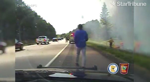 Authorities praise 3 who pulled woman from burning car