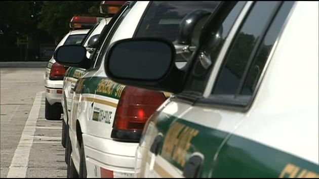 Miami-Dade police aide hit by car while investigating crash