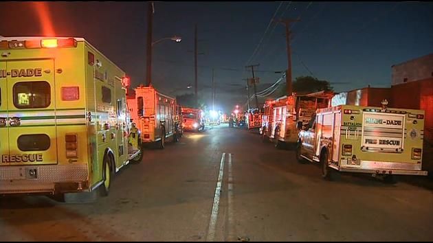 Fire sparks as smoke billows from warehouse