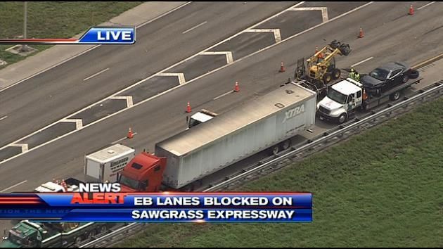 Truck crash, fuel leak closes Sawgrass Expressway for hours