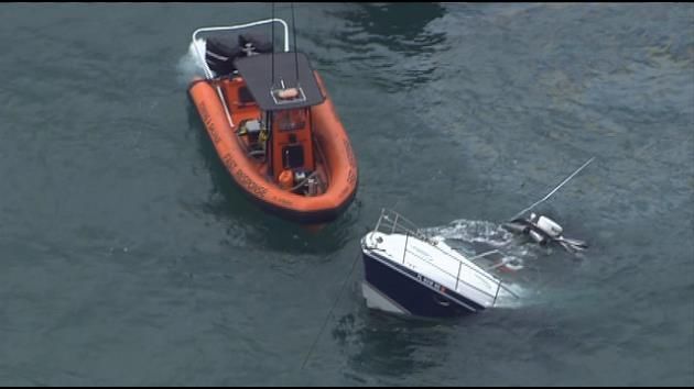 Boaters rescued after vessel takes on water