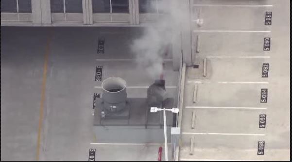 High-rise evacuated following nearby fire