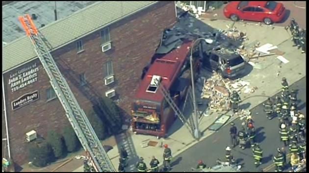 Bus crashes into NYC building, shears off part of it; 6 hurt