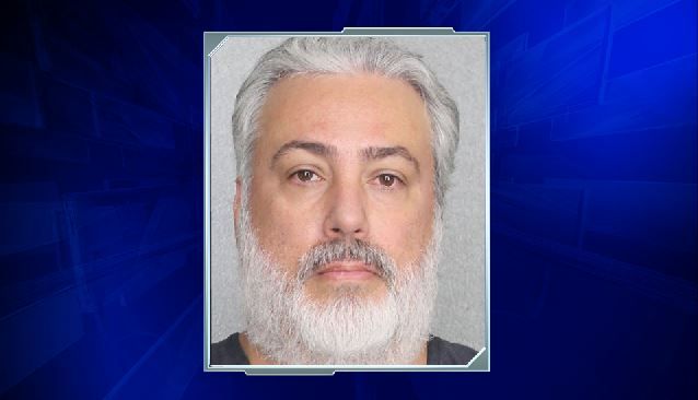 South Miami Detective who ran youth program charged with sex acts with girls