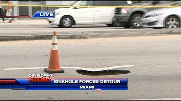 Sinkhole opens up, shuts down traffic