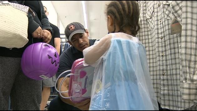 Miami firefighters take toddler displaced in fire on shopping spree