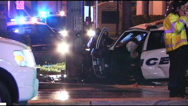 Officer hospitalized after attempted hit-and-run; driver in custody