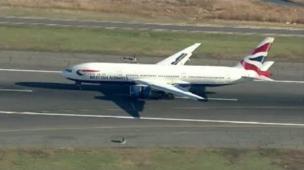 Cops: Drunk woman tried to open UK-to-Boston jet's exit door