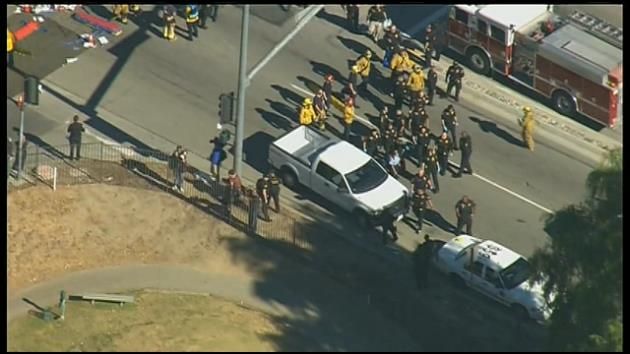 Buyer of guns used in massacre charged with terrorism counts