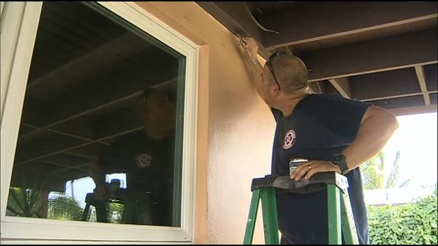 Firefighters paint home of woman they rescued