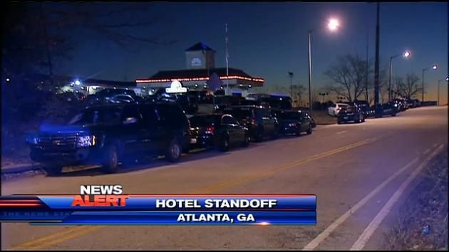 Police: Motel standoff ends with suspect stabbing himself