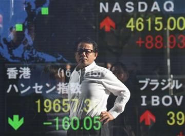 Global stock markets slide, oil falls below $30 a barrel
